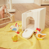 Holztiger wooden small animal shelter toy used as a chicken coop with Holztiger hen, chick and cockerel. 