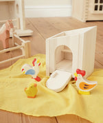 Holztiger wooden small animal shelter toy used as a chicken coop with Holztiger hen, chick and cockerel. 