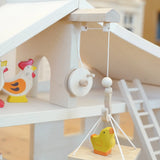 Holztiger Wooden Stable Toy With working Rope Winch carrying a Holztiger chick.