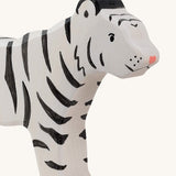 A close up of the Holztiger wooden standing white adult tiger with black stripes showing the hand painted facial features