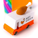 The Candylab Candyvan - Fried Chicken Van, being shown from the top. The images shows a painted chicken on the side of the van with the words "Hot Chick". The rubber chicken drumstick sits on top of the van