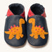 Inch Blue navy dino baby shoes available at Babipur. A soft navy baby leather shoe with a cute playful orange suede dinosaur on each shoe. Features elastic ankle cuffs for a secured fit