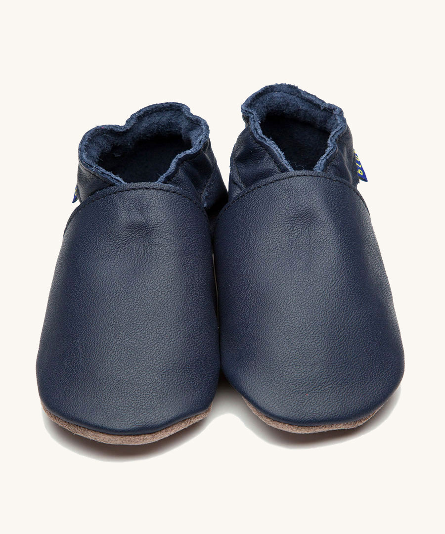 Inch Blue plain navy shoes available at Babipur. A soft navy blue baby leather shoe. Features a matching pink elastic ankle cuffs for a secured fit