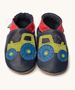 Inch Blue navy tractor baby shoes available at Babipur. A soft navy baby leather shoe with a playful green suede tractor and red collar on each shoe. Features elastic ankle cuffs for a secured fit