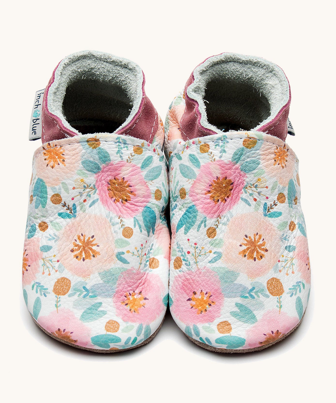 Inch Blue wildroses shoes available at Babipur. A soft white baby leather shoe with a cute pastel coloured floral design on each shoe. Features elastic ankle cuffs for a secured fit
