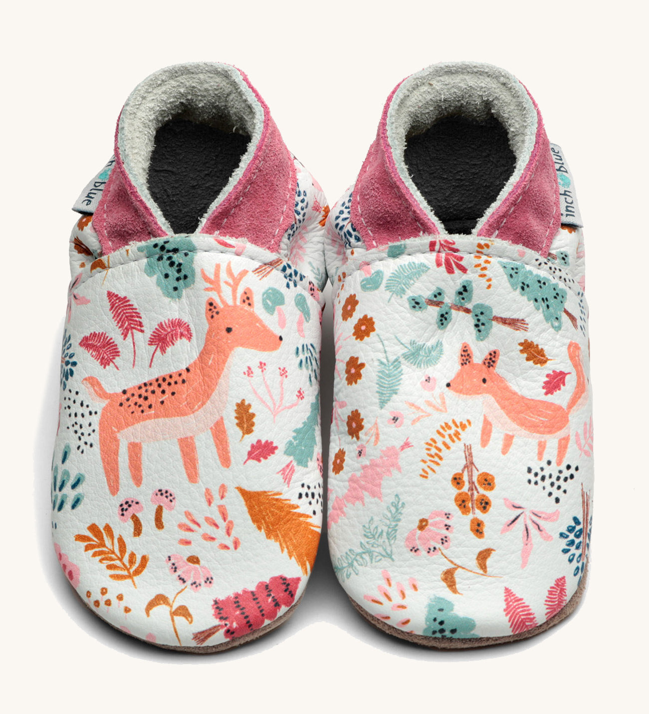 Inch Blue wildwood shoes available at Babipur. A soft white baby leather shoe with cute pastel coloured woodland animals and trees design on each shoe. Features elastic ankle cuffs for a secured fit