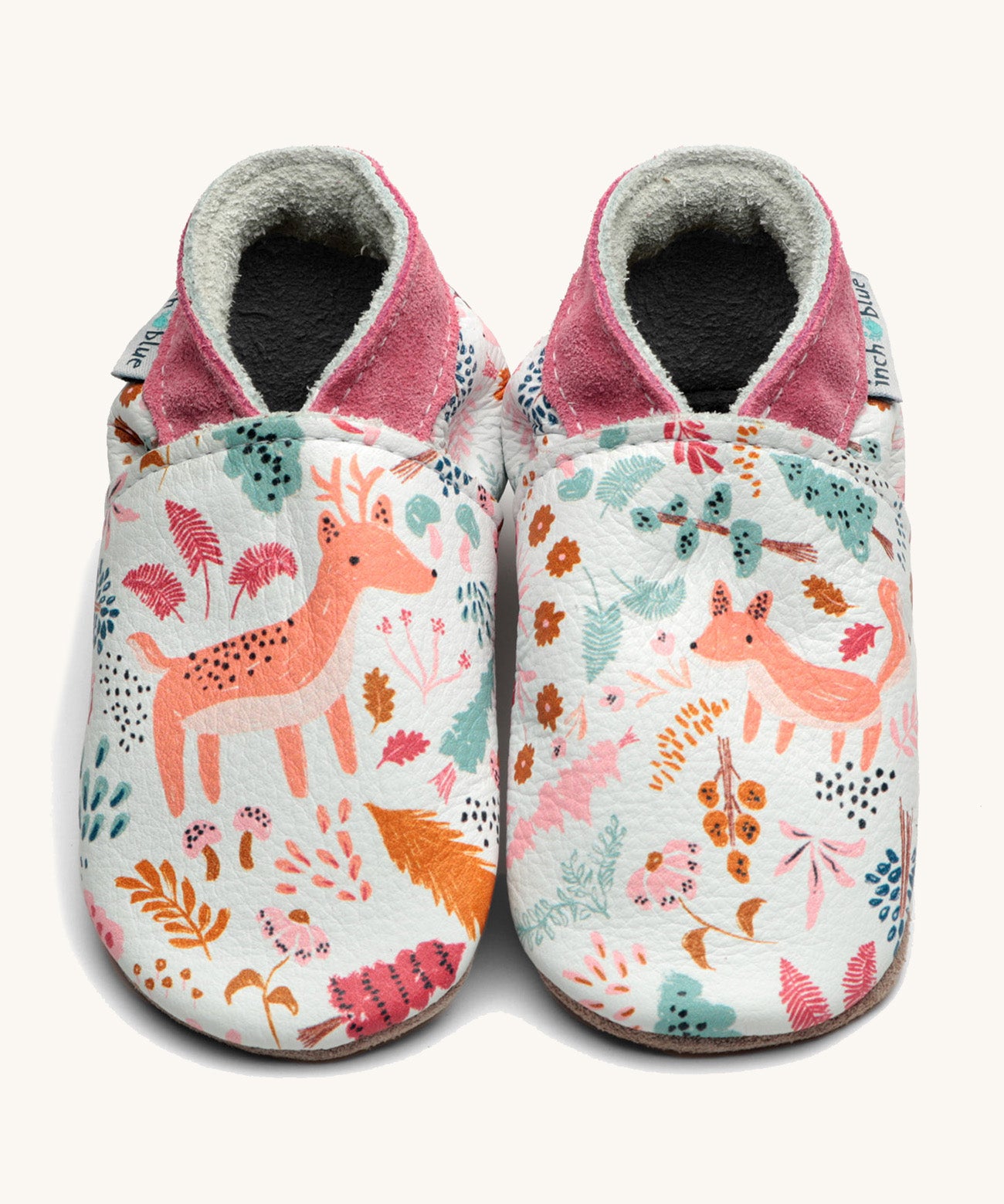 Inch Blue wildwood shoes available at Babipur. A soft white baby leather shoe with cute pastel coloured woodland animals and trees design on each shoe. Features elastic ankle cuffs for a secured fit