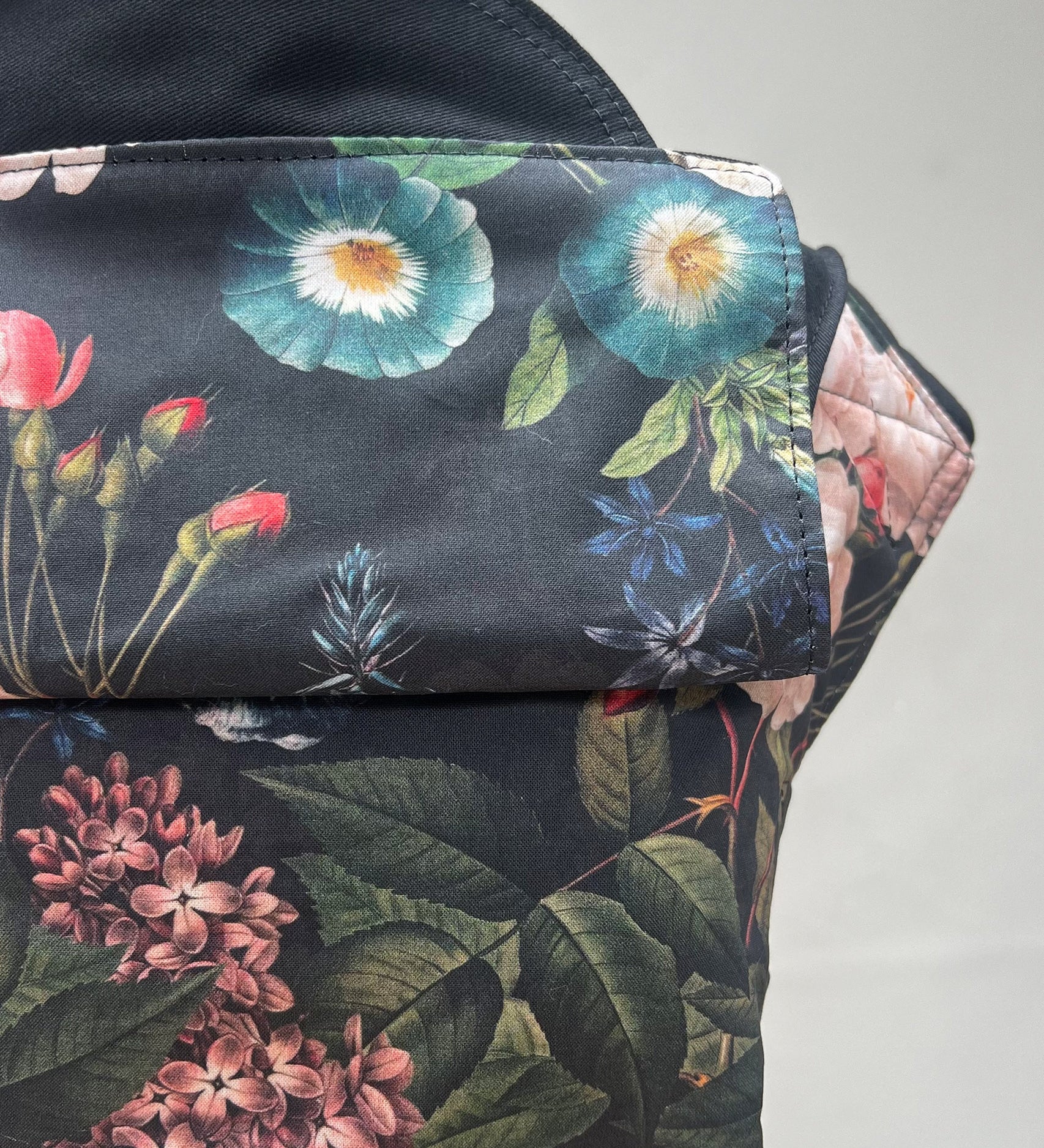 Integra Baby Carrier - Vintage Summer. Vintage Summer is a beautiful Victorian botanical floral print in soft organic cotton featuring hydrangeas, lilac and roses on a black background.