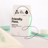 A close up of the Jack N Jill friendly dental floss available at Babipur. Showing the floss out of the box and the small cutter on the top of the box for easy cutting.