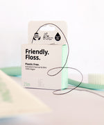 A close up of the Jack N Jill friendly dental floss available at Babipur. Showing the floss out of the box and the small cutter on the top of the box for easy cutting.