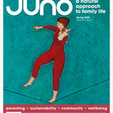 Cover of Juno Magazine Issue 95 Spring 2025. The artwork of this natural parenting magazine features an oil painting of a lady holding a naked baby on a tight rope.
