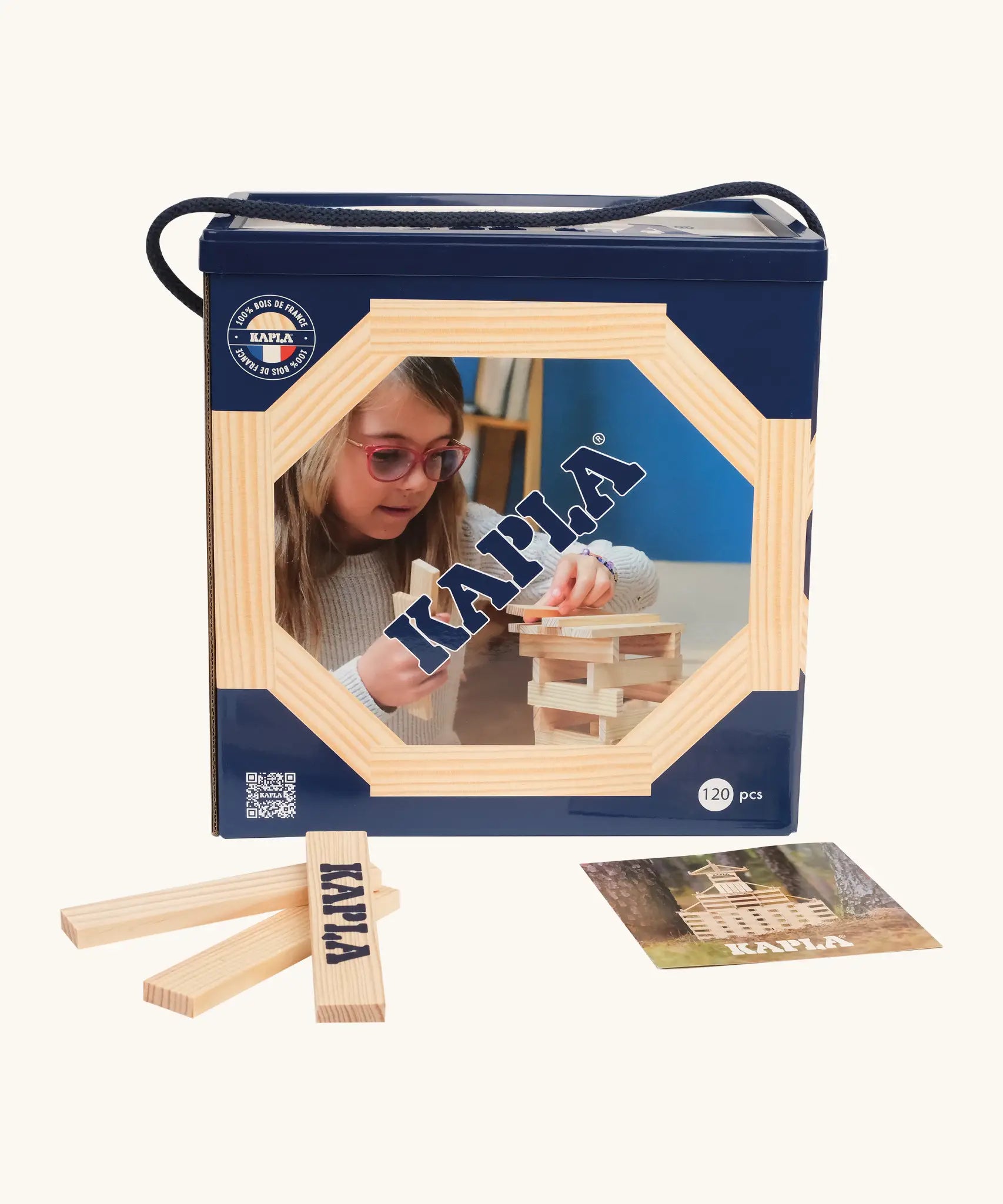 KAPLA 120 unpainted wooden construction planks box next to 3 loose planks and a booklet.