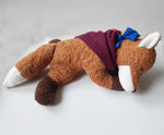 Kathe Kruse Finn the fox comforter with small blue waldorf doll on the back wrapped in the muslin bib