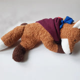 Kathe Kruse Finn the fox comforter with small blue waldorf doll on the back wrapped in the muslin bib