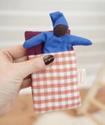 Kathe Kruse baby Waldorf Doll black skin with sleeping bag in red check.