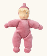Kathe Kruse Lolo Rose waldorf doll showing a light pink towelling outfit, light skin and yellow hair.