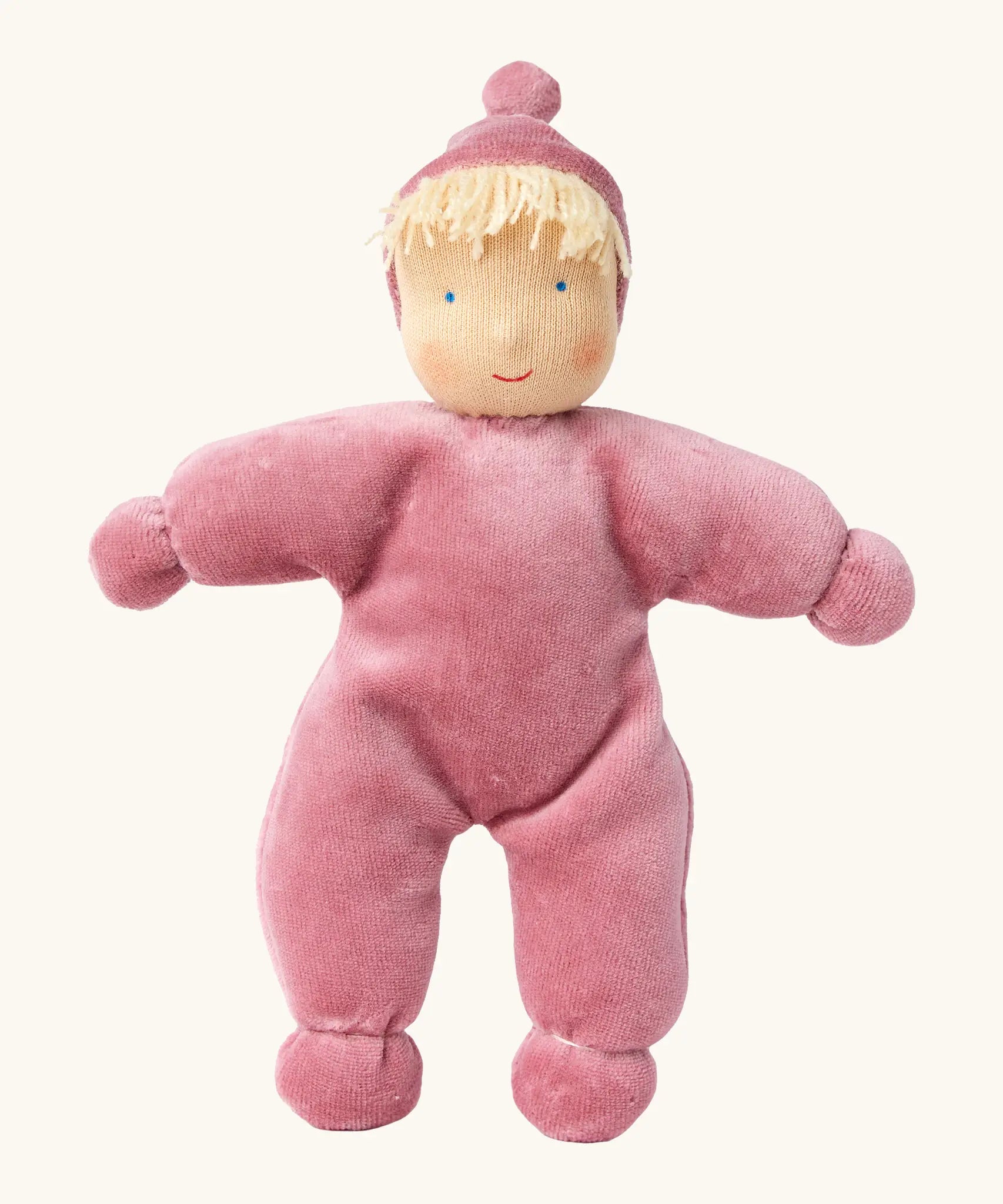 Kathe Kruse Lolo Rose waldorf doll showing a light pink towelling outfit, light skin and yellow hair.