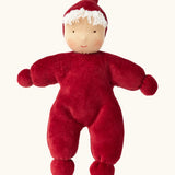 Kathe Kruse Lolo Ruby Waldorf doll showing a red towelling outfit, light skin and white hair.