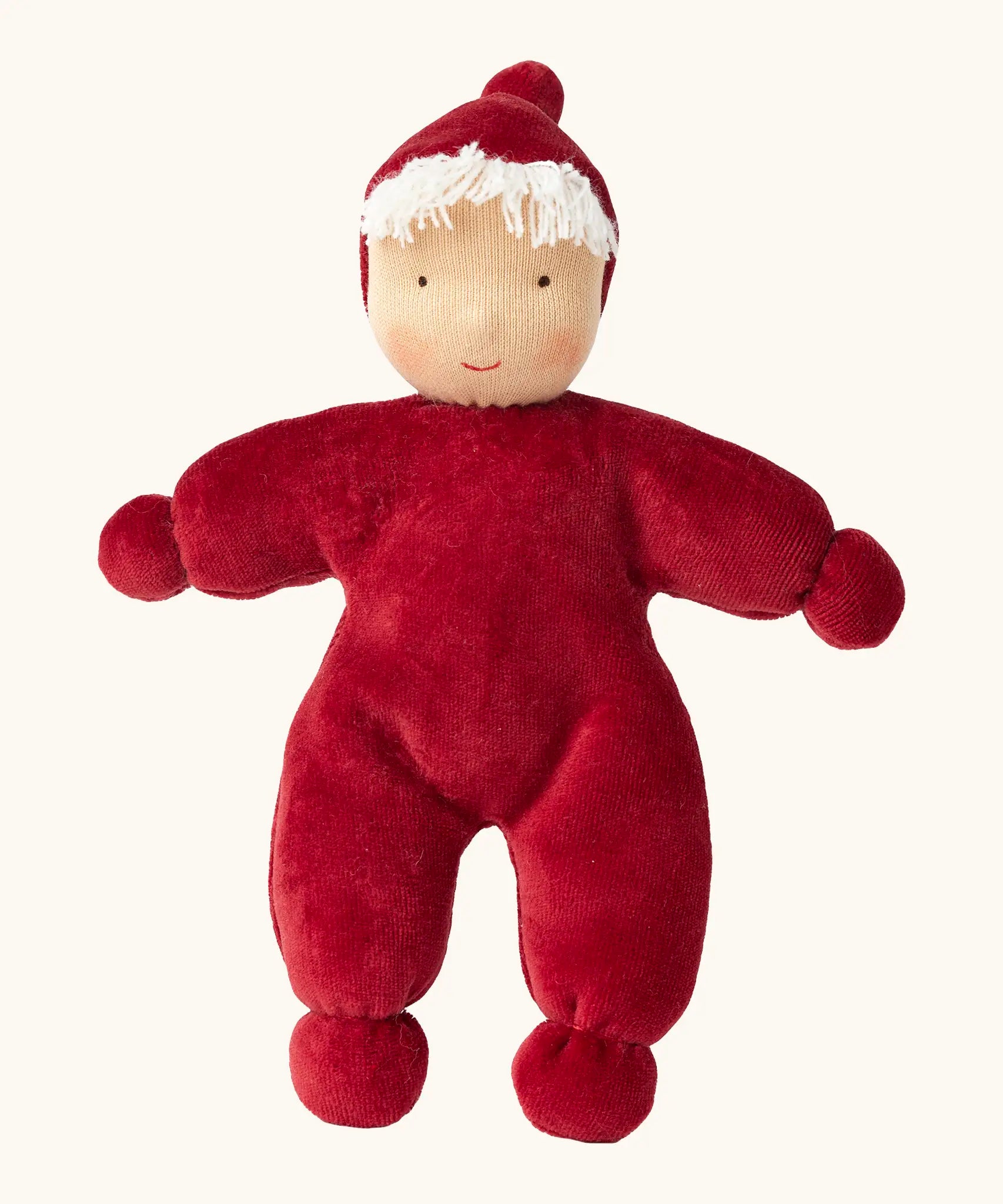 Kathe Kruse Lolo Ruby Waldorf doll showing a red towelling outfit, light skin and white hair.