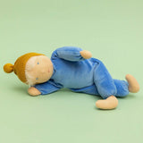 Kathe Kruse cloud nana waldorf doll lying on a green surface