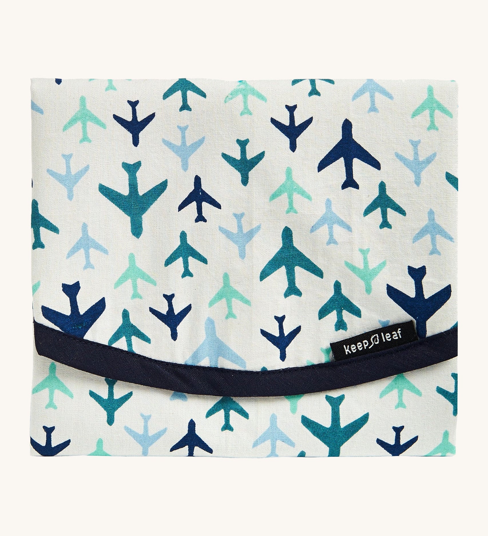 Keep Leaf food wrap in Plane design available at Babipur.. A cream colour organic cotton wrap for food with blue plane design printed all over and dark navy trim. Features a velcro lid for easy fastening