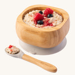 Porridge topped with fresh berries in the Eco Rascals Bamboo Bowl & Spoon Weaning Set in grey silicone.