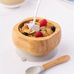 Milk being poured onto breakfast cereal with fresh fruit in the Eco Rascals Bamboo Bowl & Spoon Weaning Set in grey silicone.