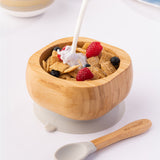 Milk being poured onto breakfast cereal with fresh fruit in the Eco Rascals Bamboo Bowl & Spoon Weaning Set in grey silicone.