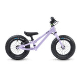 A side profile view of the Early Rider Big Foot Balance Bike - Violet Haze, on a cream background
