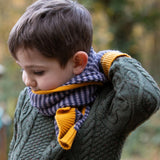 A child wearing the LGR lovely Dreamy Blue Stripe scarf and mittens
