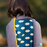 A closer view of the stripe knitted details on the Dream Blue Scarf. A soft, organic knit scarf being worn by a child