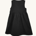 The back of the Eco Outfitters organic and fair trade cotton school pinafore dress in black.