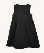 The back of the Eco Outfitters organic and fair trade cotton school pinafore dress in black.
