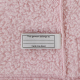 The Hand Me Down label inside the Patagonia Baby Furry Friends Hoody