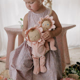 A child holding Olli Ella Limited Edition Tulip Dozy Dinkum - Talia Tulip & Dinky Dinkum Doll - Tessa Tulip in their arms