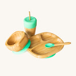 Eco Rascals Bamboo Section Plate Gift Set, a bowl, portion plate, baby spoon and cup with straw in bamboo and green silicone.