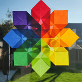 Kite Waxed Paper sunflower craft, an origami flower in rainbow Waldorf colours.