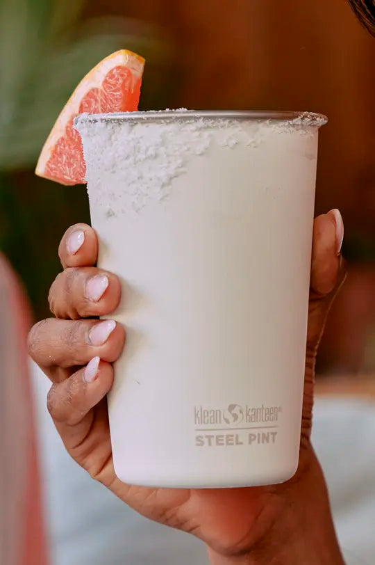 Klean Kanteen reusable stainless steel pint tumbler in tofu white for outdoor drinking.