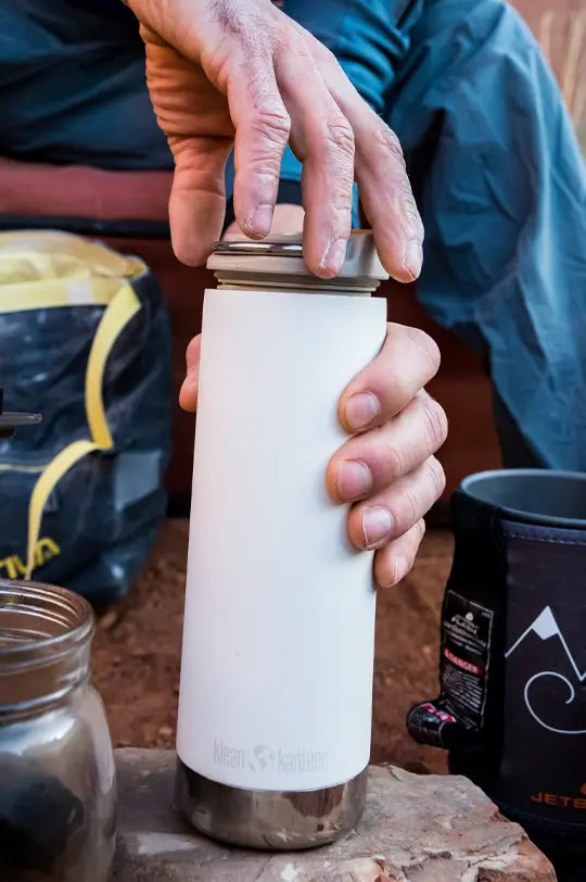 Klean Kanteen TKWide Reusable Insulated Bottle in white tofu, leakproof lid with carry hook.