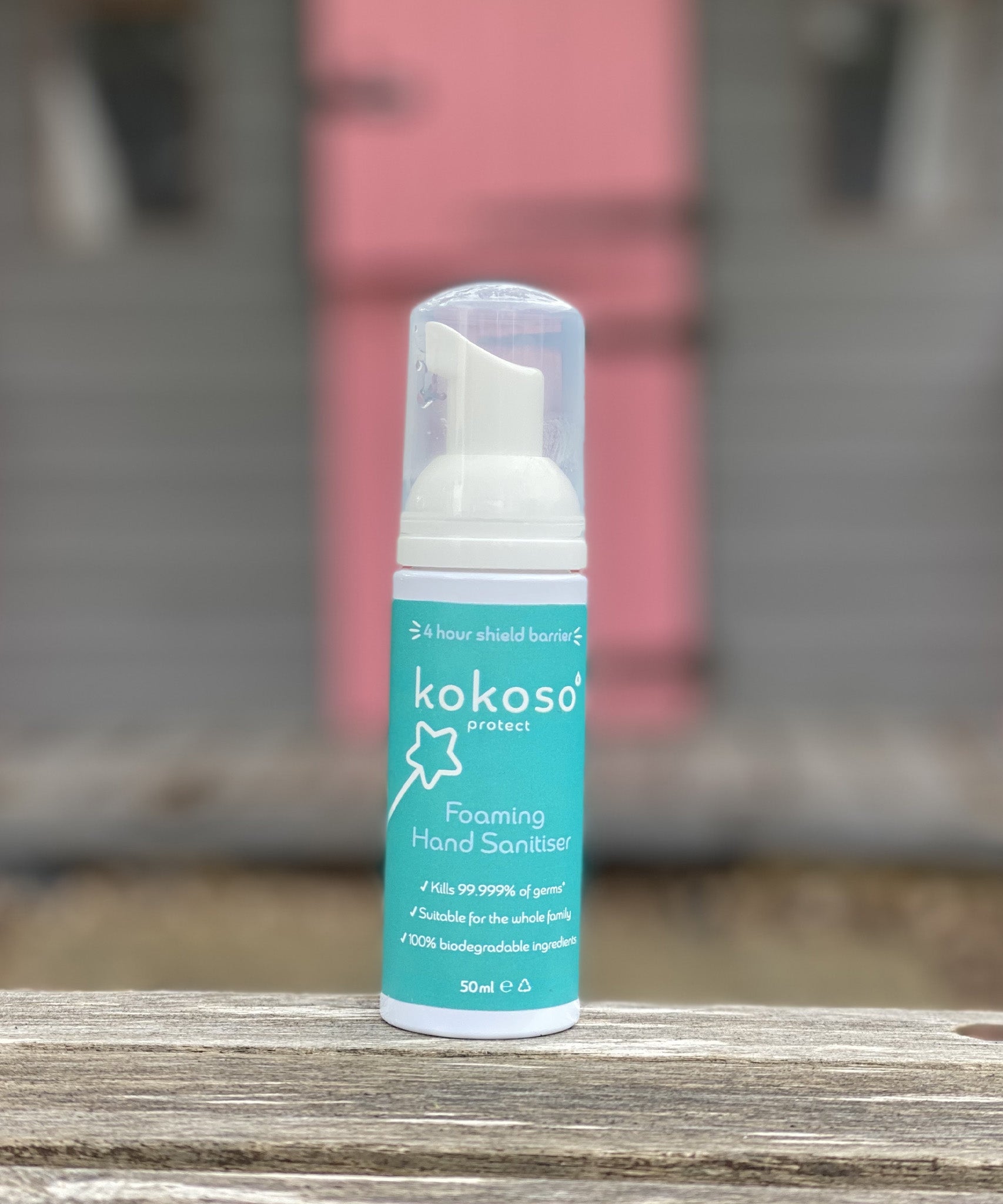 Kokoso protect foaming hand sanitiser original 50ml bottle standing on a wooden surface. Bottle available at Babipur 