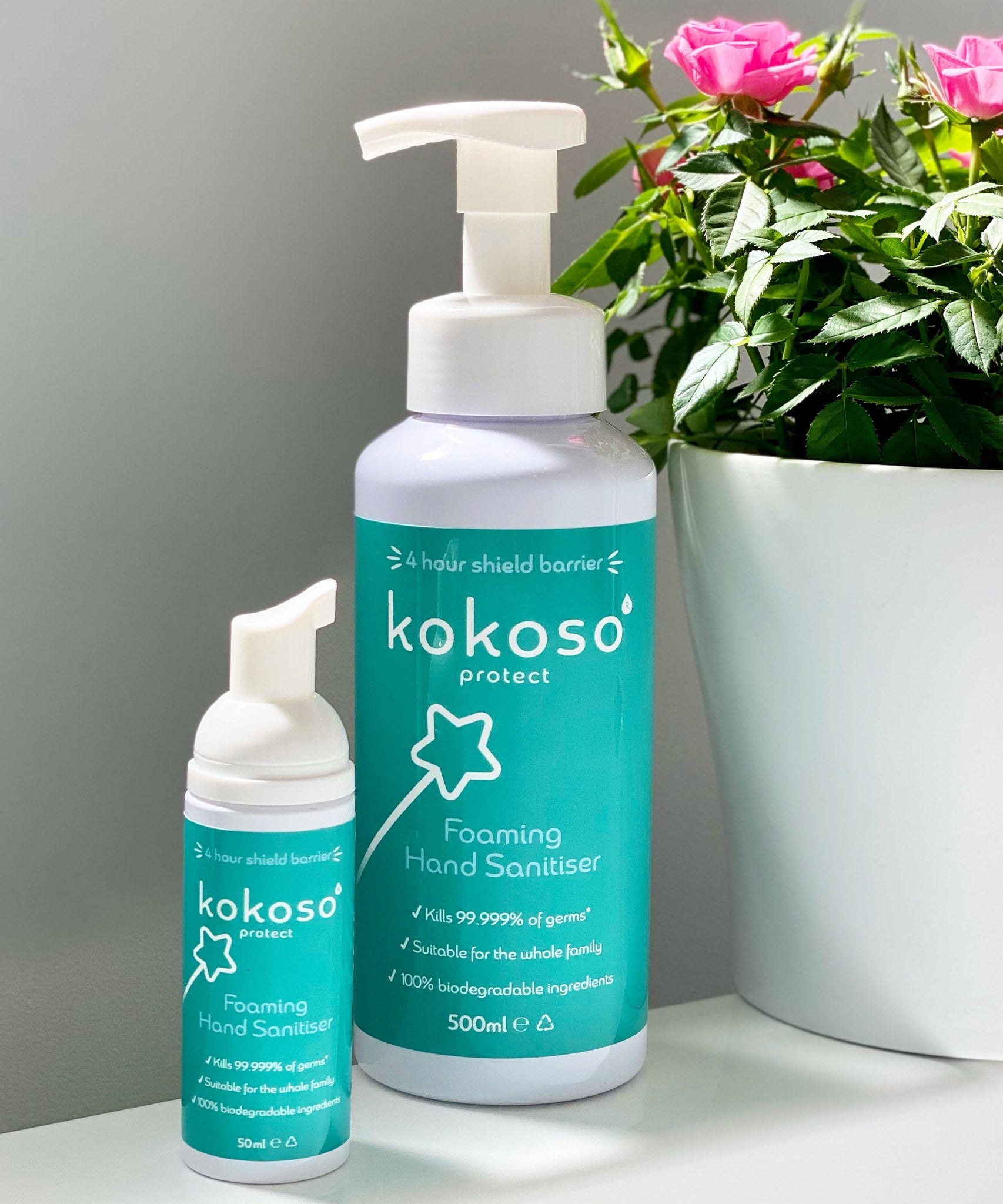 Kokoso protect foaming hand sanitiser original 500ml bottle standing next to the 50ml bottle, both bottles are available at Babipur