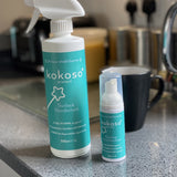 Kokoso protect foaming hand sanitiser original 50ml bottle standing next to the Kokoso surface disinfectant bottle. Both available at Babipur