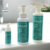The Kokoso protect range standing on the side of the bath including the 500ml and 50ml foaming hand sanitiser and surface disinfectant, all available at Babipur