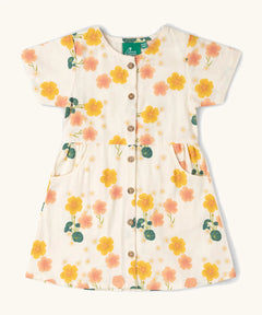 Little Green Radicals kids short sleeve dress with a repeating flower print. Shows full length front buttons and side pockets