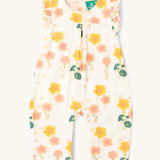 Little Green Radicals kids flora frill summer romper dress in cream with a repeating floral design.  
