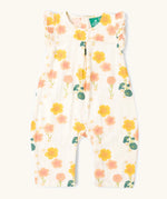 Little Green Radicals kids flora frill summer romper dress in cream with a repeating floral design.  