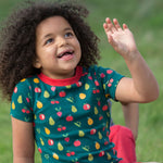 A child outside, wearing the LGR Vegetable Patch Short Sleeve T-Shirt