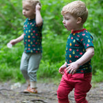 Two children playing outside, both wearing the LGR Vegetable Patch Short Sleeve T-Shirt
