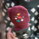 A closer look at the flower embroidered detail on the Hazelnut mittens