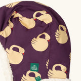 Close up of Little Green Radicals  sleeping swans print sherpa fleece lined purple hat. Purple organic cotton sherpa fleece lined flapper style hat with a sleeping swans print. 